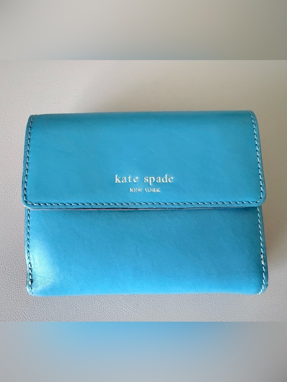 Kate Spade Turquoise Leather Compact Wallet with Gold Logo